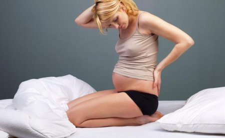 Что делать, если болит спина после беременности